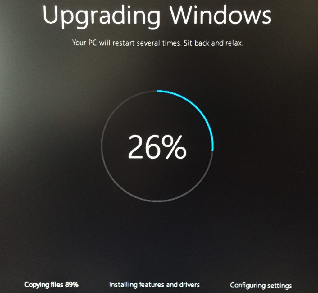 Image shows Windows upgrade in progress.