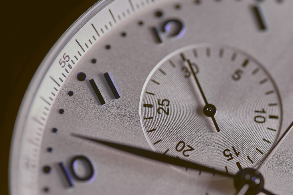 Close-up shot of a clock suggests just how important time is for a company.