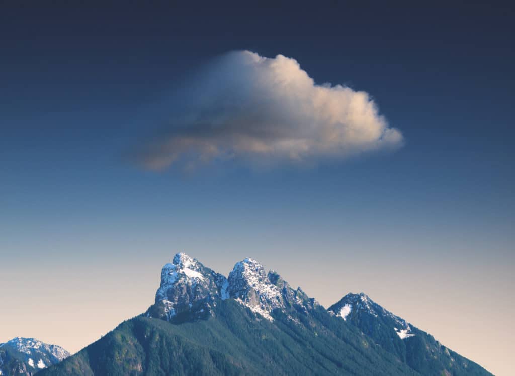 Image of a cloud and a snowy mountaintop beautifully represents the Cloud for Sustainability.
