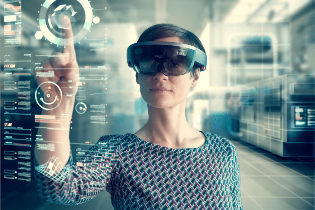 Image shows a woman using a HoloLens for mixed reality.