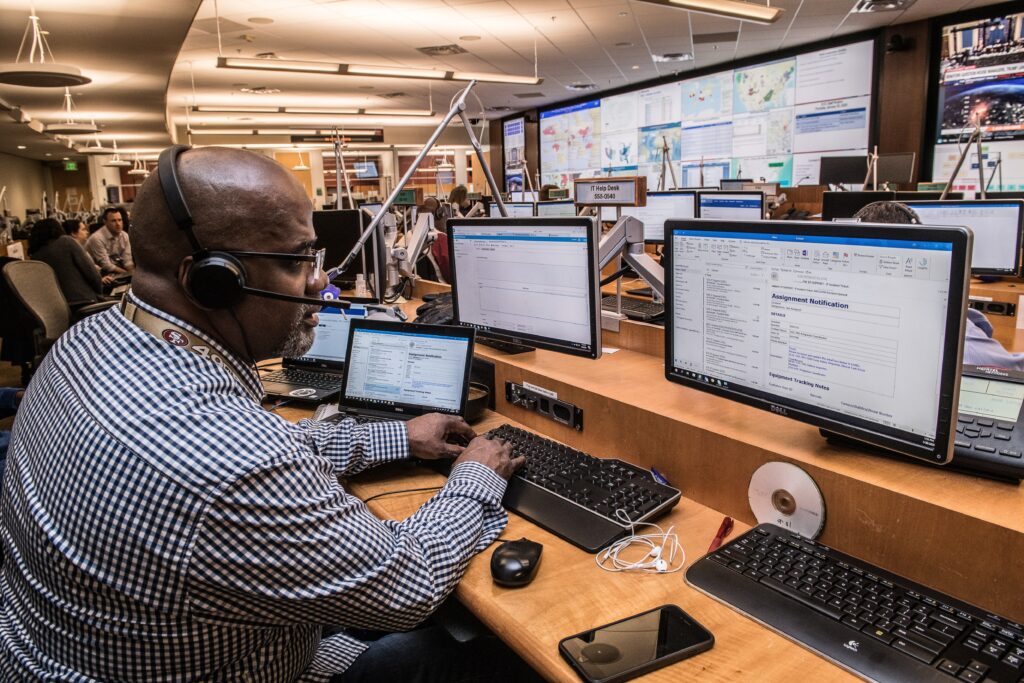 Image of a man working with data gives an example of when Microsoft Purview could be helpful.