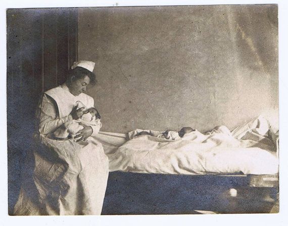 Image of a midwife attending to a newborn