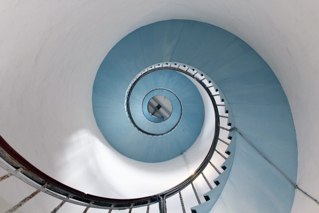Spiraling staircase suggests the evolution of human-machine relationships.