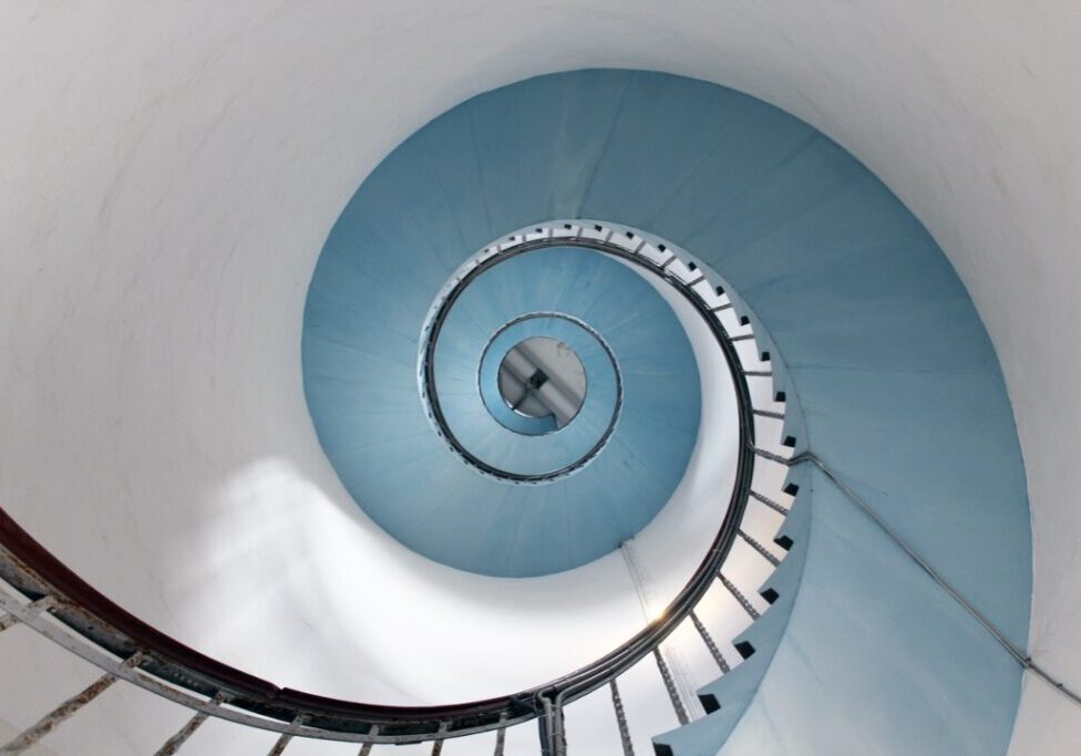Spiraling staircase suggests the evolution of human-machine relationships.