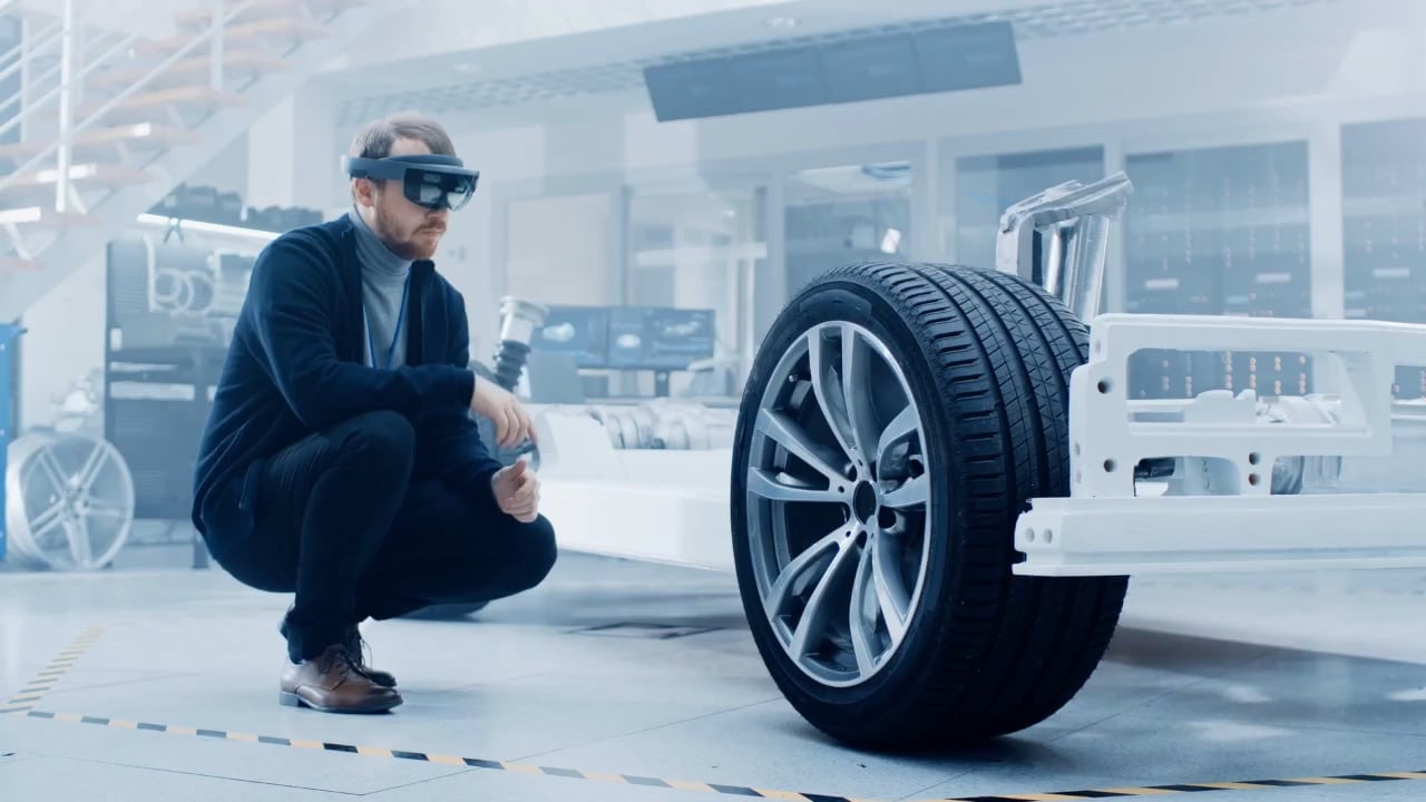 Image of a man designing a tire with augmented reality shows what innovation services could make possible.